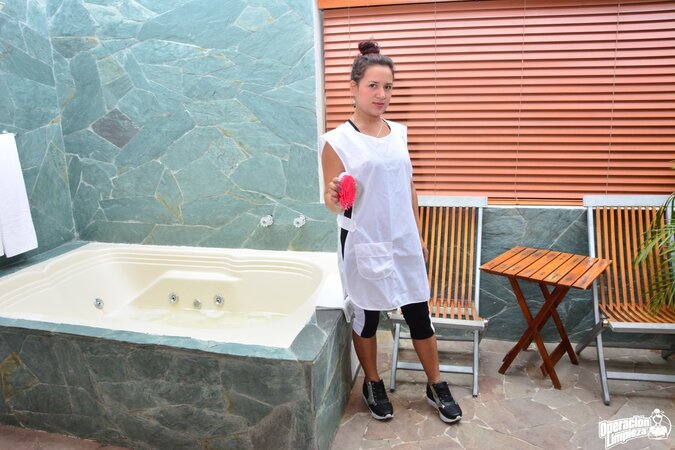 Alluring babe with a firm ass is going to expose her slit