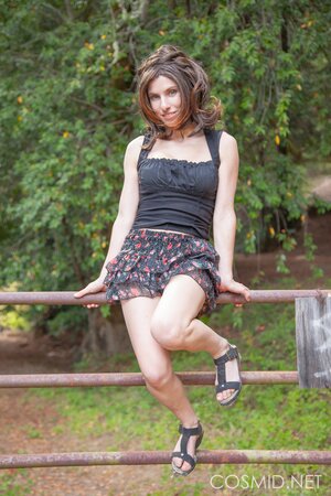 Pretty gal takes off her panties to showcase twat in the woods