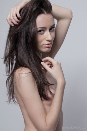 Lean brunette with a shaved slit is here to showcase herself