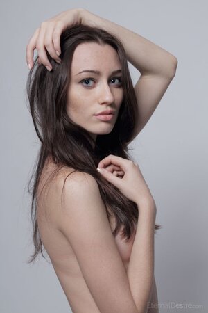 Lean brunette with a shaved slit is here to showcase herself