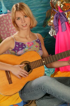 Playing the guitar before ditching it for some solo toying