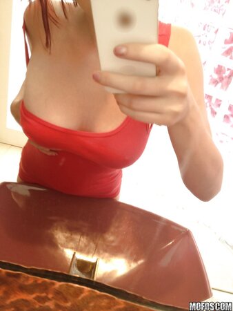 Nerdy redhead with pale skin treats excited pussy with fingers in amateur gallery