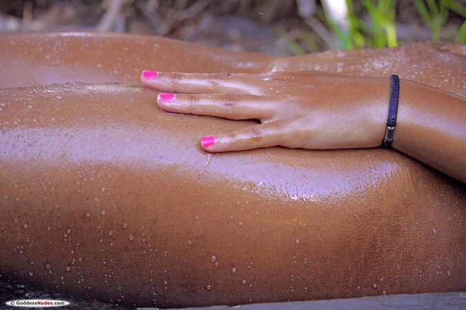 Ebony girl getting wet while showering and masturbating