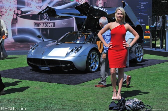 Stunner is posing by the newest cars before going indoors