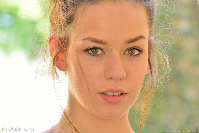 Beautiful woman with green eyes progressively getting nude