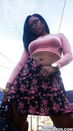Cute wife Porsha Carrera bends over and flashes her big booty