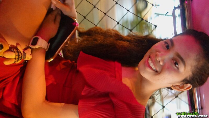 Sweet Thai teen has fun walking with a foreign photographer