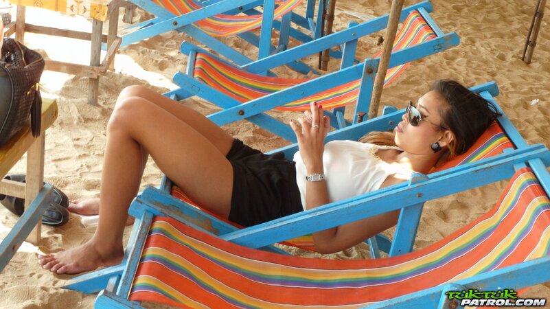 Brunette Asian in a sexy bikini wants you to kiss the screen