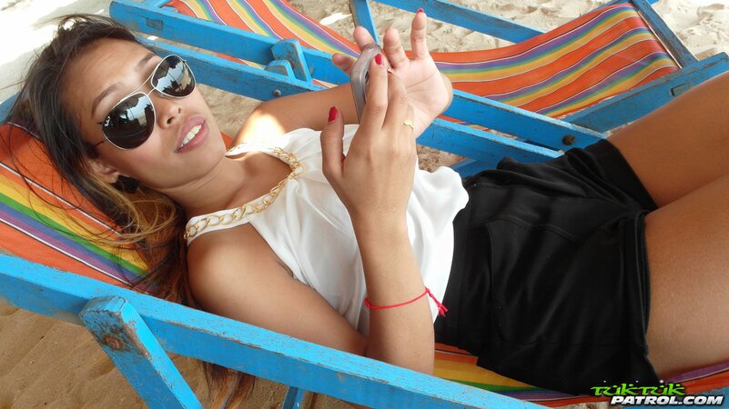 Brunette Asian in a sexy bikini wants you to kiss the screen