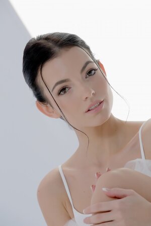 Brunette ballerina exposing her long legs and wet pussy