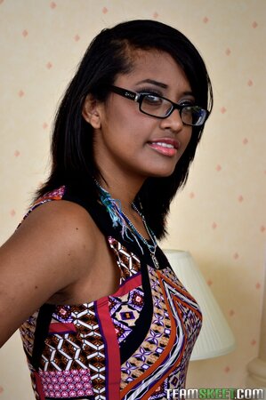 Cute teen Diana Love strips and leaves nothing on but her glasses