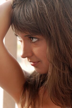 Dark hair hottie shows her insane tan lines and a pretty body