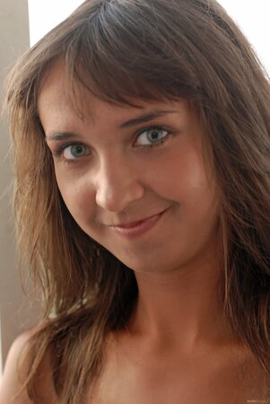 Dark hair hottie shows her insane tan lines and a pretty body