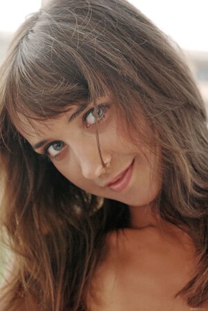 Dark hair hottie shows her insane tan lines and a pretty body