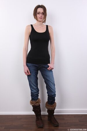 Geeky babe with natural boobs is showing off her backside too