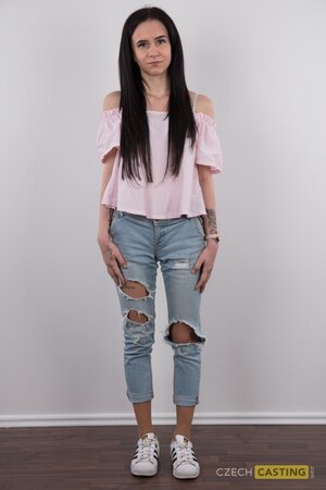 Pretty girl with sexy jeans on shows her tattoos and great pussy