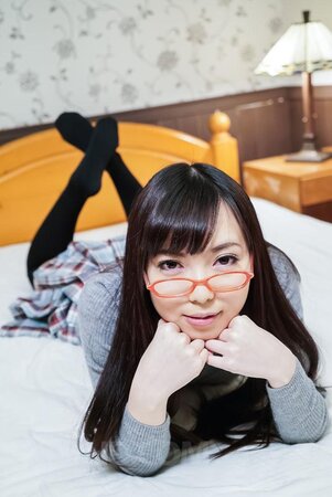 Adorable Asian student using her feet to keep his dick hard
