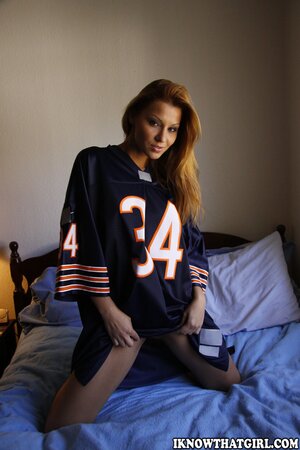 Slender football fan girl bonks innocent pussy with thick red vibrator