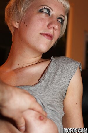 Bitch with short hair takes top off and lets take some amateur pics of her cunt