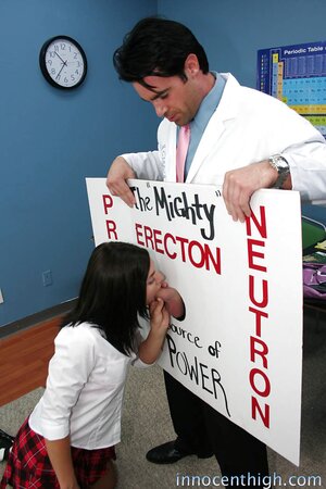 Brunette student gags on teacher's manhood through improvised gloryhole