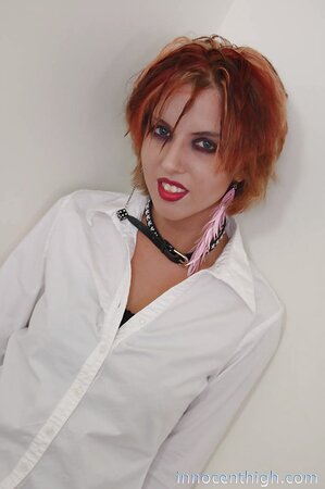 Experienced babe with crazy haircut and bright lipstick shows off butt cheeks