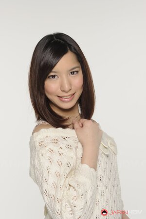 Young Japanese girl poses in short skirt that accentuates her long legs