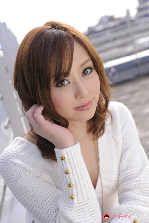 Entrancing Japanese model comes to the roof where flashes breasts and pussy