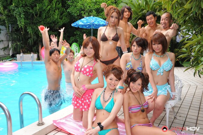 Oriental girlfriends in skimpy bikinis rest half-naked with men poolside