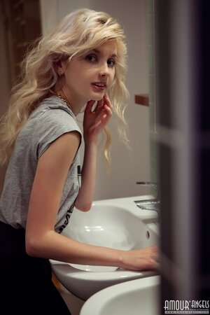 Angelik peels off her clothes to spread naked at her desk