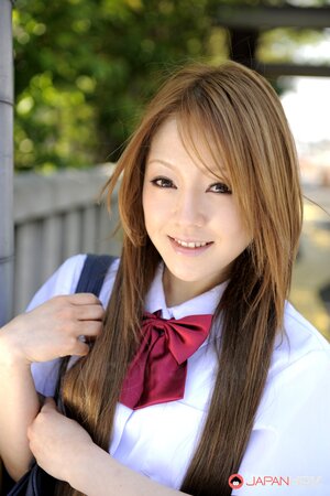 Japanese schoolgirl Ria Sakurai flashes sexy panties outside