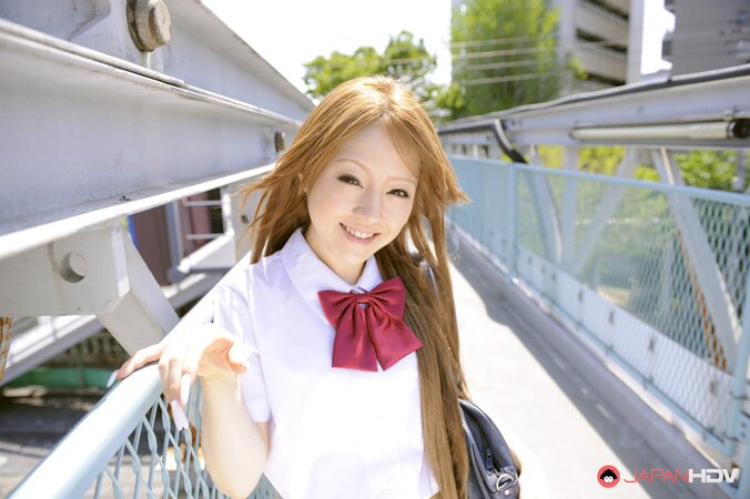 Japanese schoolgirl Ria Sakurai flashes sexy panties outside