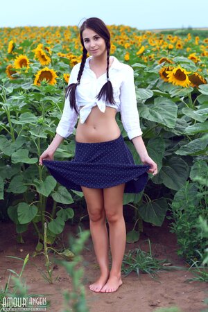Vanessa Sky shows off her skinny ass naked in the sunflowers