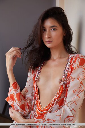 Solo model Bambi Joli enjoys posing naked after stripping