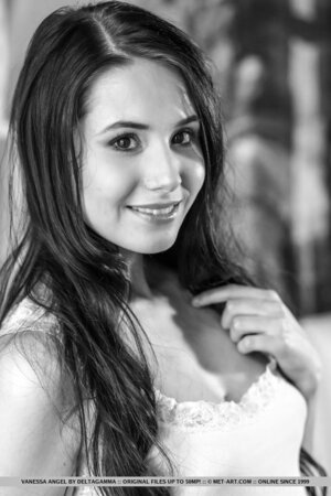 Gorgeous petite playgirl Vanessa Angel shows off her shaved pussy and fingers herself