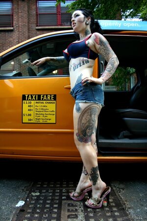 Tattooed cab driver Adahlia strips naked and masturbates in the back seat