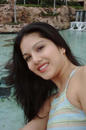 Sunny Leone lets her short dress reveal parts of her big booty
