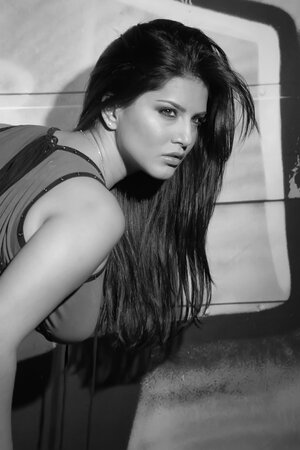 Sunny Leone displays her great curves in a sexy tight dress