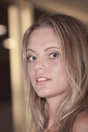 Blonde Hungarian cutie Vanda Lust enjoys unveiling her hot natural titties