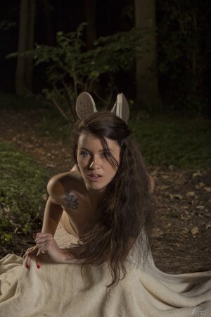 Misha Cross poses nude in the forest after stripping