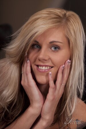 Blonde beauty Sindy Vega enjoys wearing nothing more than a smile on her pretty face