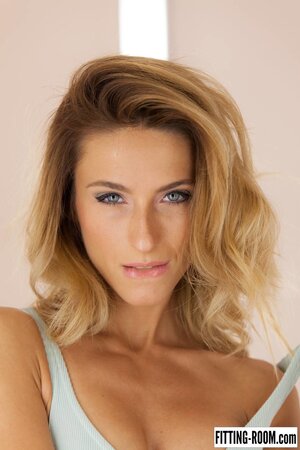 One piece tease from a blonde who's tanned and kinky AF