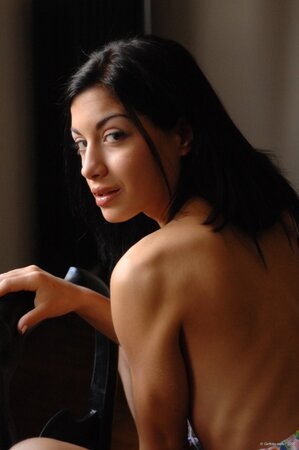 Dark-haired beauty strips naked in the South of France