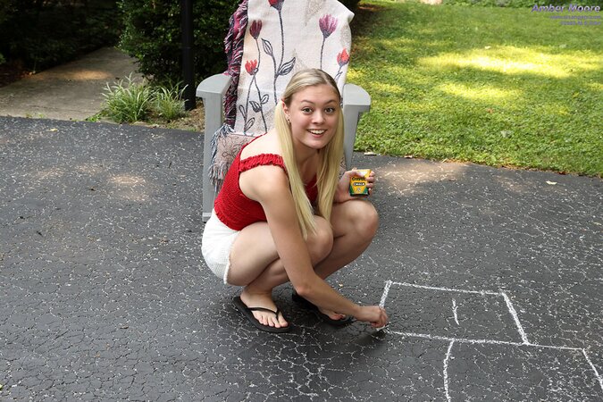 Amber Moore pees on driveway while toying bald teen pussy