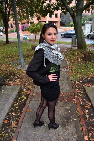 Stylish scarf Latina is going to pose in a cute way in public