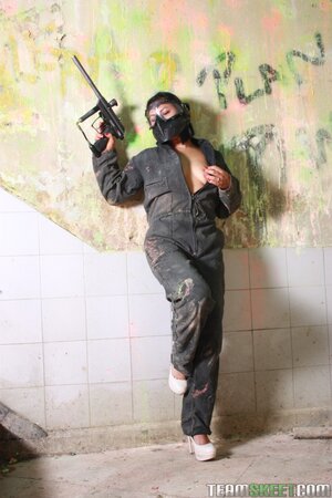 Sandra Flores strips to lingerie on paintball field