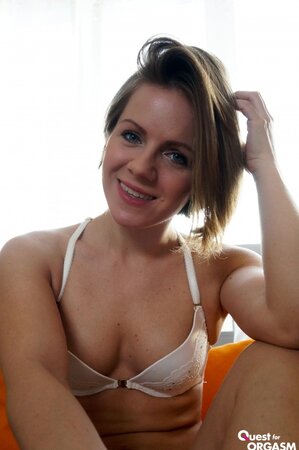 Sasha Zima toys her horny snatch erotically on the bed