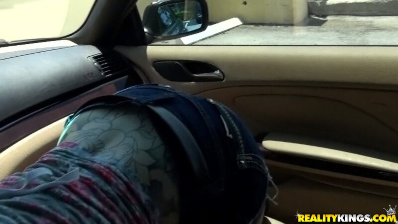 Red-haired cutie licking dick up and down in the car