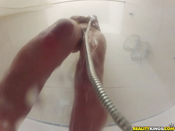 Innocent sexpot with perfect boobs seductively washes sexy body in bathroom
