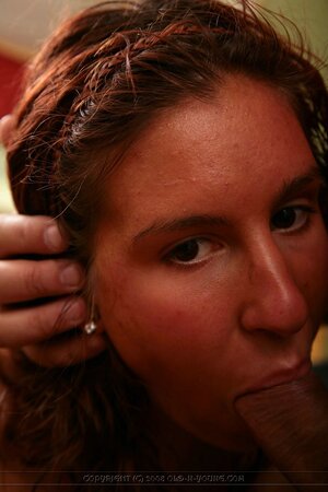 Ginger chick takes dick in mouth and pussy on camera in front of a mirror