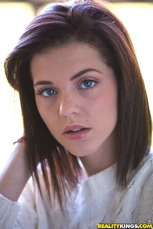 Thoughtful teen Kiera Winters takes off white sweaters and panties on the balcony